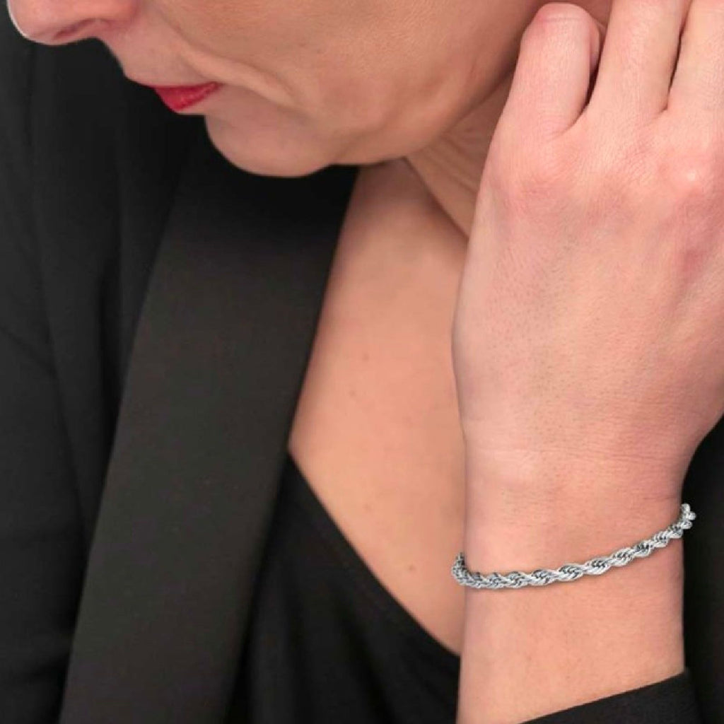 BRACCIALE UOMO IN ACCIAIO CON PIETRE NERE ED ELEMENTI SILVER